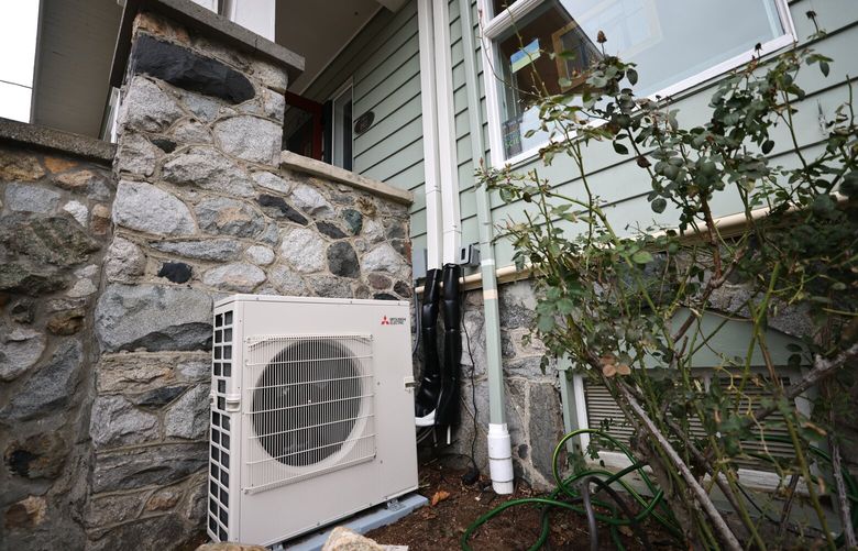 The heat pump and line set outside the house. Michael O’Neill and his wife Katie Raser live in West Seattle in an older home and recently went through a heat pump installation that has not gone totally according to plan, photographed on Friday, February 3, 2023.