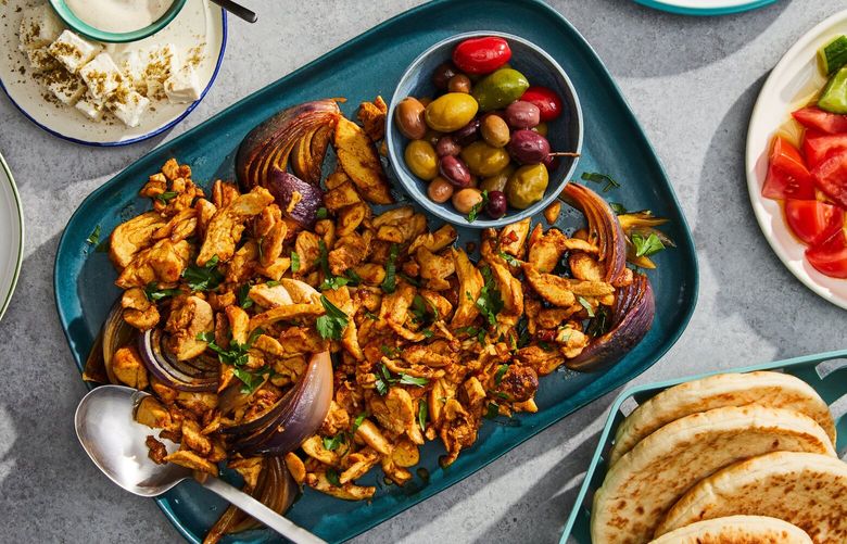 Oven-roasted chicken shawarma in New York, Feb. 27, 2023. Here is a recipe for an oven-roasted version of the classic street-side flavor bomb usually cooked on a rotisserie. Food styled by Hadas Smirnoff. Props styled by Megan Hedgepeth. (Linda Xiao/The New York Times)