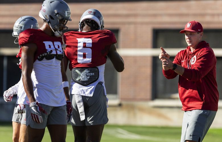 Washington State coach Jake Dickert coaches up his players Monday.

The Washington State Cougars practiced Monday, August 15, 2022 in Pullman, WA. 221278