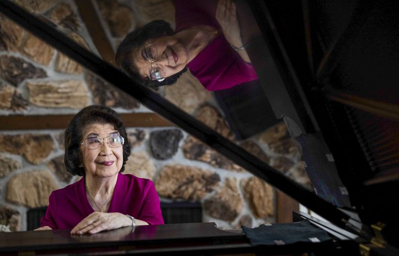 Michi Hirata North, 91, is photographed in her Bellevue home on Thursday, March 23, 2023.  She is about to perform her final piano concert April 16 at Town Hall.