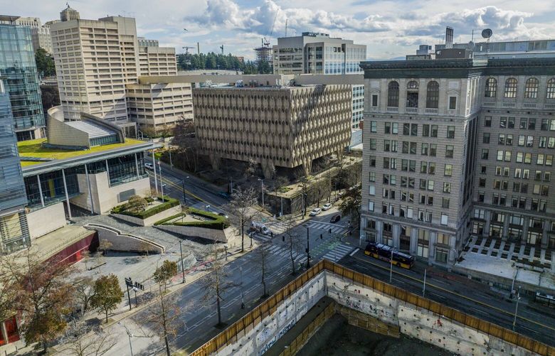 From right, The King County Courthouse, Administrative Building and Corrections Facility in Seattle on Tuesday, March 7, 2023. Dow Constantine is proposing redeveloping the county government’s campus to bring a mix of residential and commercial uses to the area.