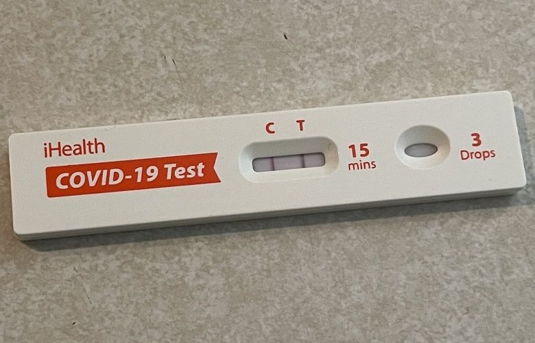 A home Covid-19 rapid test showing a positive result.