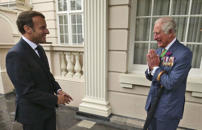 FILE – Britain’s Prince Charles welcomes French president Emmanuel Macron, left, to Clarence House in London, Thursday June 18, 2020. French President Emmanuel Macron’s office on Friday, March 24, 2023, said a state visit by Britain’s King Charles III has been postponed amid mass strikes and protests in France. The king had been scheduled to arrive in France on Sunday on his first state visit as monarch, before heading to Germany on Wednesday. (Jonathan Brady/Pool via AP, File) LBL101 LBL101
