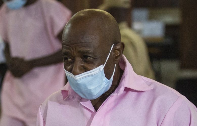 FILE – Paul Rusesabagina, who inspired the film “Hotel Rwanda” and is credited with saving more than 1,000 people by sheltering them at the hotel he managed during the genocide, attends a court hearing in Kigali, Rwanda, Friday Feb. 26, 2021. Rwanda’s government has commuted the sentence of Paul Rusesabagina was convicted of terrorism offenses years later in a widely criticized trial. Government spokeswoman Yolande Makolo told The Associated Press on Friday, March 24, 2023, that the 25-year sentence was commuted by presidential order after a request for clemency. (AP Photo/Muhizi Olivier, File) RWA101 RWA101