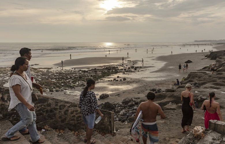 Late afternoon at Echo beach in Bali, Indonesia, March 23, 2023. After multiple accounts of tourists behaving badly, the governor of the tropical paradise with a welcoming reputation wants Russia and Ukraine to lose access to Indonesia’s visa-on-arrival program. (Nyimas Laula/The New York Times) XNYT78