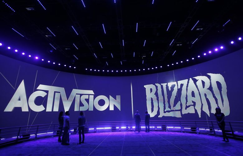 FILE – The Activision Blizzard Booth is shown on June 13, 2013, during the Electronic Entertainment Expo in Los Angeles. British antitrust regulators scrutinizing Microsoft’s blockbuster purchase of videogame maker Activision Blizzard narrowed their investigation on Friday, March 24, 2023 by dropping concerns the deal would hurt the console gaming market. (AP Photo/Jae C. Hong, File) LFP101 LFP101