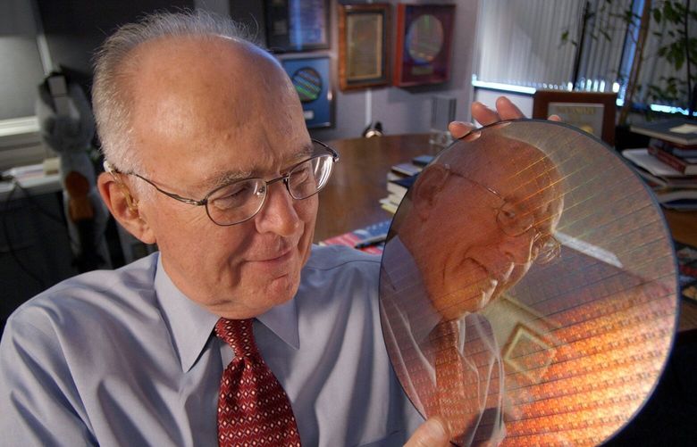 Intel Corp. co-founder Gordon Moore holds up a silicon wafer at Intel headquarters in Santa Clara, Calif., Wednesday, March 9, 2005, during the 40th anniversary of “Moore’s Law”. Moore saw that the number of components on an integrated circuit had doubled every year and figured that rate would continue for a decade as transistors were made smaller. He saw that the per-component costs would fall as manufacturing improved. (AP Photo/Paul Sakuma)