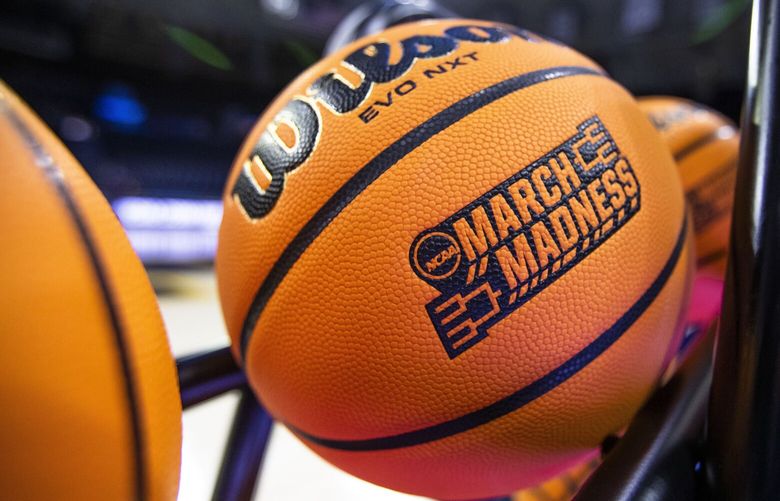FILE – A basketball with a March Madness logo rests on a rack before a First Four game between Illinois and Mississippi State in the NCAA women’s basketball tournament Wednesday, March 15, 2023, in South Bend, Ind. An estimated 68 million Americans are expected to place bets on this years NCAA Men’s Basketball Tournament. And with a recent explosion in legalized online sports gambling across the United States, the opportunities to bet on this year’s bracket will reach far beyond your office pool.  (AP Photo/Michael Caterina, File) NYBZ405 NYBZ405