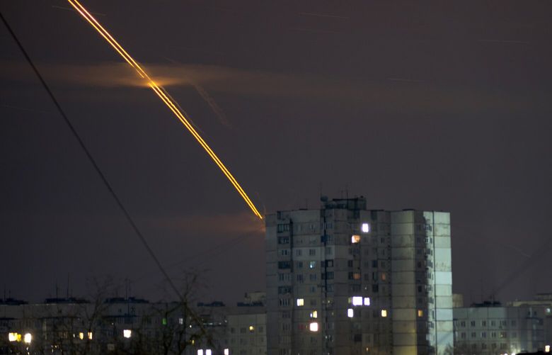 Russian rockets launched against Ukraine from Russia’s Belgorod region streak across the sky at dawn in Kharkiv, Ukraine, early Friday, March 24, 2023. (AP Photo/Vadim Belikov) XSG165 XSG165