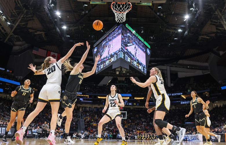 Colorado’s Kindyll Wetta (15) puts up a shot against Iowa in the first half. 223349 (Dean Rutz / The Seattle Times)