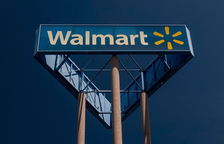 Signage outside a Walmart store  2021. MUST CREDIT: Bloomberg photo by David Paul Morris.