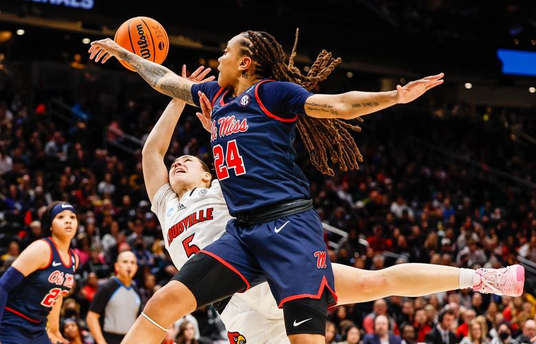 Ole Miss’ Madison Scott (24) fouls Louisville’s Mykasa Robinson as she shoots in the lane in the first quarter. 223350