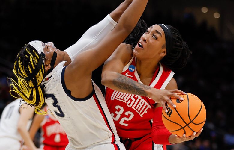 Ohio State forward Cotie McMahon drives on UConn forward Aaliyah Edwards during the first quarter. 223352