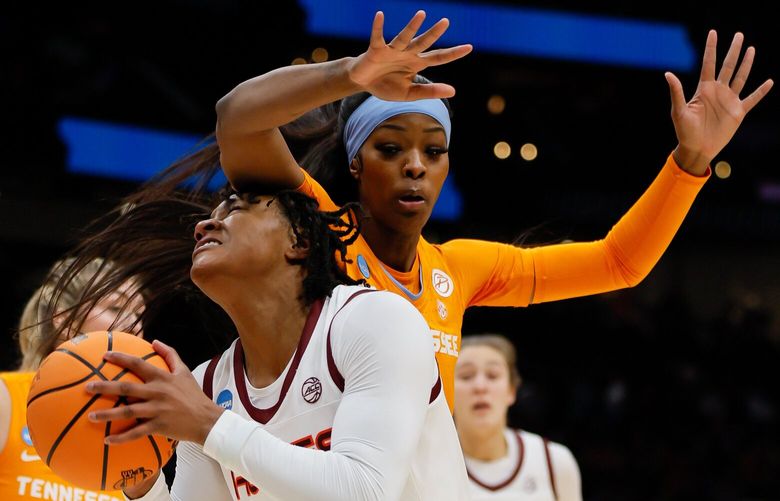 Virginia Tech Hokies forward Taylor Soule gets an arm to the head as she drives on Tennessee Lady Vols forward Rickea Jackson during the first quarter. 223351