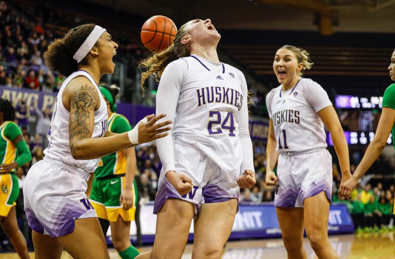 Elle Ladine lets out a roar after she gets the bucket and the foul against Oregon with just under a minute to play in the third quarter.  The bucket gave Washington a 46-41 lead. (Dean Rutz / The Seattle Times)