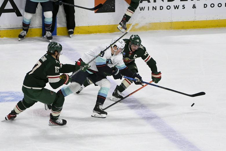 Jared Spurgeon Minnesota Wild Unsigned White Jersey Skating with Puck vs. Los Angeles Kings Photograph