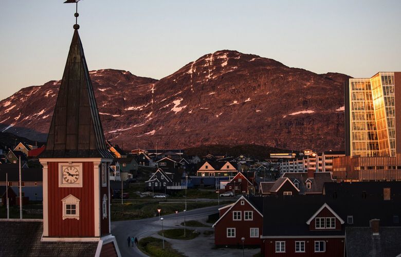 FILE – The sun sets over Nuuk, Greenland, Monday, July, 31, 2017. Like most European nations, Greenland switched over to daylight saving time on March 25, 2023, moving their clocks one hour forward. But they observed the seasonal ritual for the last time. When most of Europe and the United States fall back an hour again in the fall, Greenlanders won’t. (AP Photo/David Goldman, File) LBL102 LBL102