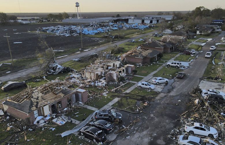 Damage is seen on properties in Rolling Fork, Miss., where three days earlier a tornado ripped through the town, Monday, March 27, 2023, in Rolling Fork, Miss. (AP Photo/Julio Cortez) MSJC102 MSJC102