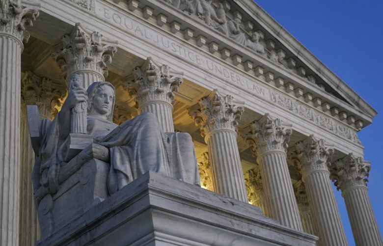 FILE- Light illuminates part of the Supreme Court building on Capitol Hill in Washington, Nov. 16, 2022. The Supreme Court will decide whether a disabled activist can file disability rights lawsuits against hotels she doesn’t intend to visit. (AP Photo/Patrick Semansky, File) WX101 WX101