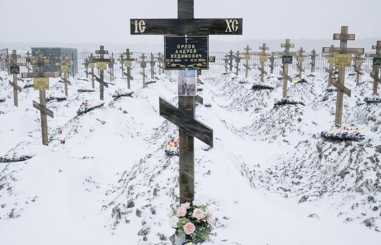 The grave of Wagner soldiers at a cemetery in the Krasnodar region of Russia, Feb. 7, 2023. As thousands of ex-prisoners fight and die in Ukraine, honoring their memory is becoming a patriotic imperative in Russia. But some committed crimes their old neighbors cannot forget. (Nanna Heitmann/The New York Times) XNYT3 XNYT3