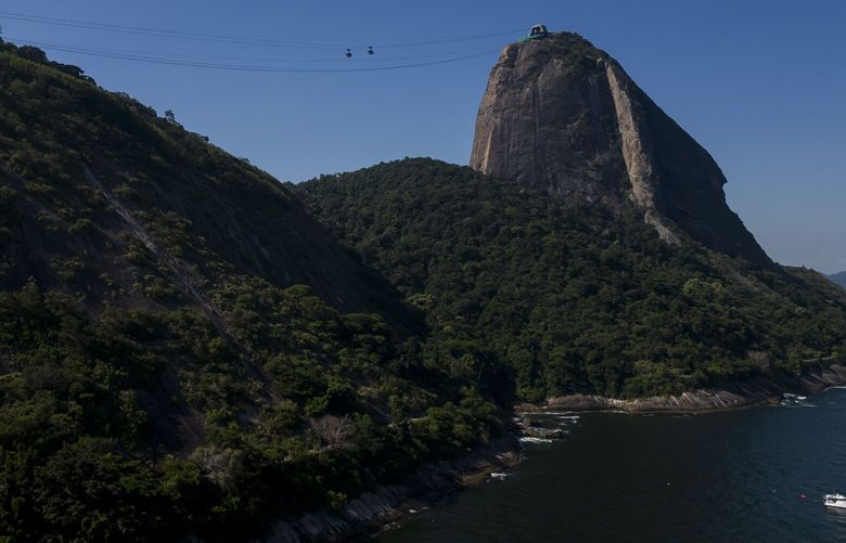 View of Sugar Loaf Mountain on the day that residents and activists protested against the installation of a zip line in the city’s icon and UNESCO World Heritage Site, in Rio de Janeiro, Brazil, Sunday, March 26, 2023. (AP Photo/Bruna Prado) XBP105 XBP105