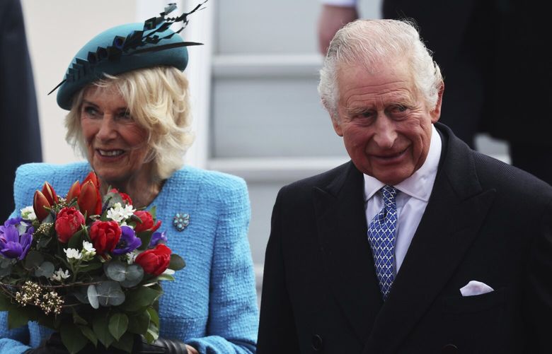 Britain’s King Charles III and Camilla, the Queen Consort, arrive at the airport in Berlin, Wednesday, March 29, 2023. King Charles III arrives Wednesday for a three-day official visit to Germany. (Jens Buettner/dpa via AP) DMME107 DMME107