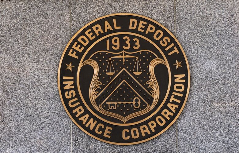 The Federal Deposit Insurance Corporation (FDIC) seal is shown outside its headquarters, Tuesday, March 14, 2023. Depositors withdrew savings, and investors broadly sold off bank shares as the federal government raced to reassure Americans that the banking system is secure following two bank failures. (AP Photo/Manuel Balce Ceneta) DCMC103 DCMC103