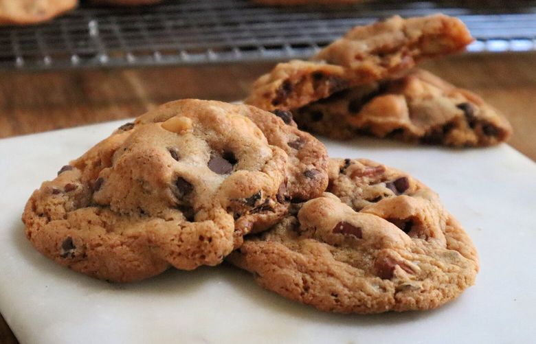 Butterscotch pudding mix is the secret weapon in these ooey-gooey cookies studded with chocolate chips and toasted pecans. (Gretchen McKay/Pittsburgh Post-Gazette/TNS) 64341057W