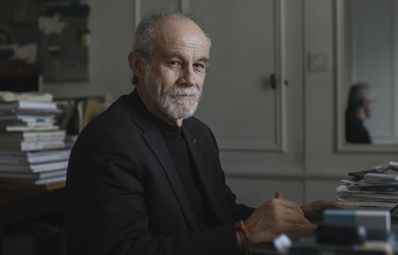 Carlos Moreno, a scientist and business professor at Sorbonne University, at home in Paris on March 18, 2023. Moreno has faced harassment in online forums and over email in recent weeks. (Dmitry Kostyukov/The New York Times)