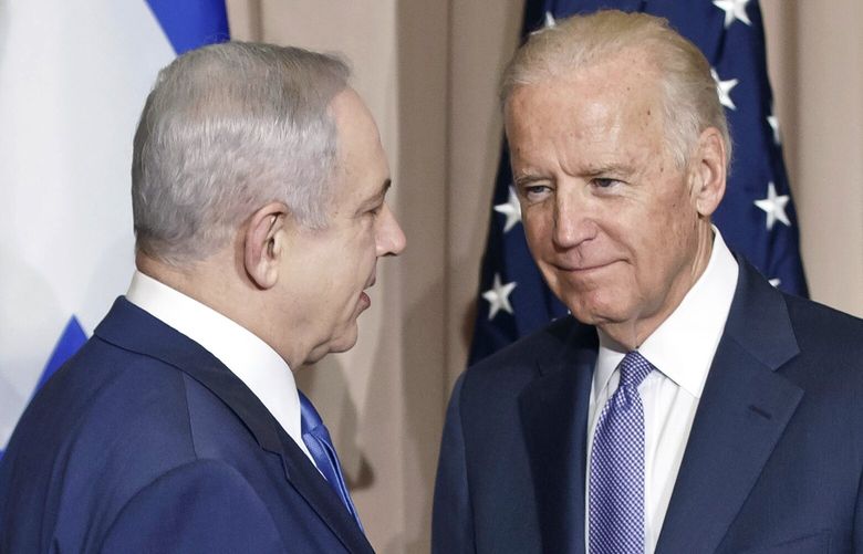 FILE – Israeli Prime Minister Benjamin Netanyahu, left, and Vice President Joe Biden talk prior to a meeting on the sidelines of the World Economic Forum in Davos, Switzerland, Jan. 21, 2016. President Joe Biden spoke Sunday, March 19, 2023, with Israeli Prime Minister Benjamin Netanyahu to “express concern” over his government’s planned overhaul of the country’s judicial system that has sparked widespread protests across Israel and to encourage compromise. (AP Photo/Michel Euler, File) WX104 WX104
