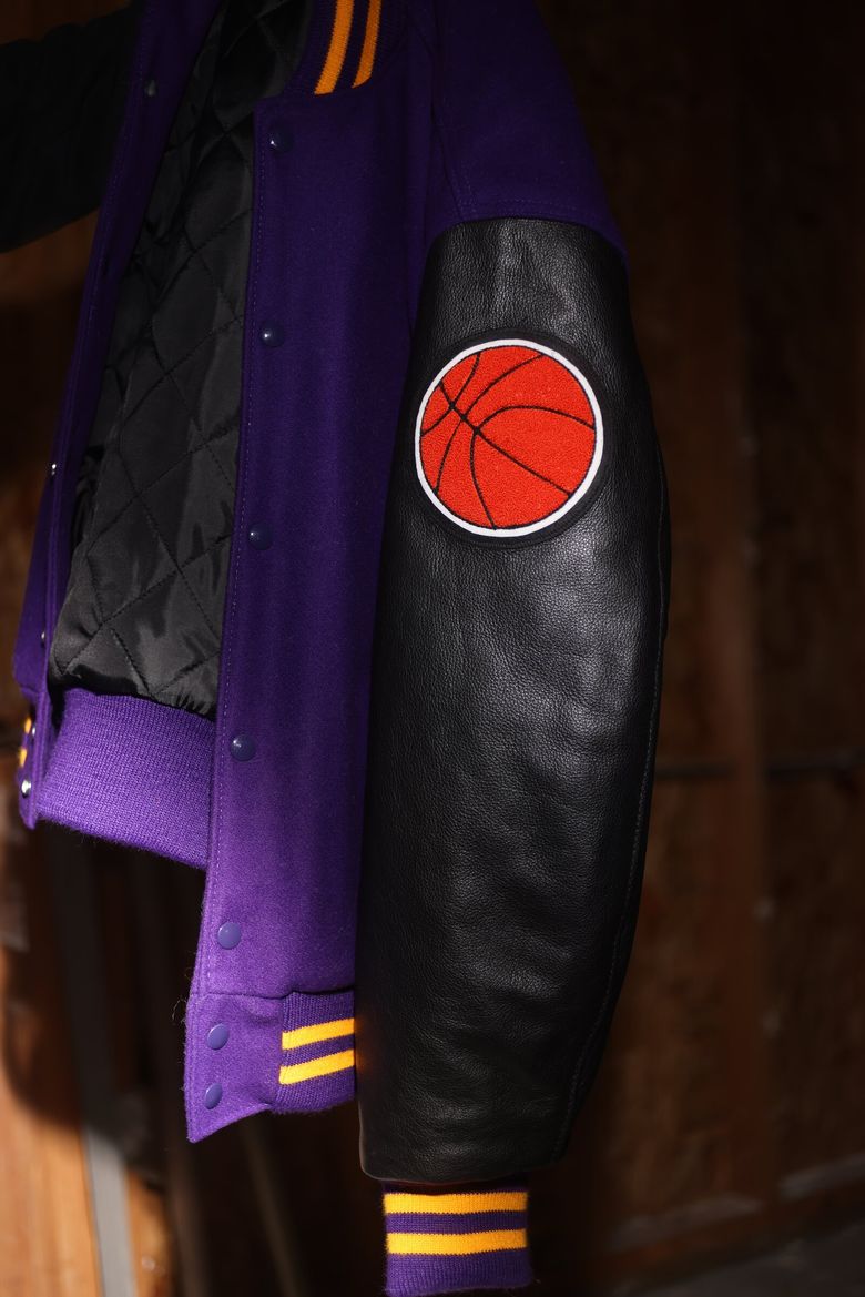 A letterman jacket belonging to a player on the Sumner High School  basketball team. &#8220;He used to be my role model,&#8221; the player said of Jackson.  (Karen Ducey / The Seattle Times)