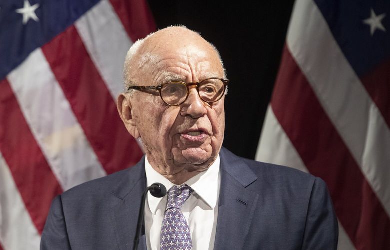 FILE – Rupert Murdoch introduces Secretary of State Mike Pompeo during the Herman Kahn Award Gala, in New York, Oct. 30, 2018. Tucker Carlson, Sean Hannity and Bret Baier are among the stars that both Fox News and the voting machine company suing it for defamation have signaled could testify if the explosive case heads to trial next month.(AP Photo/Mary Altaffer, File) WX108 WX108