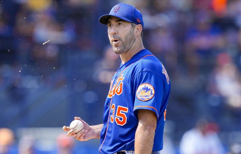 New York Mets starting pitcher Justin Verlander (35) prepares to throw during the third inning of a spring training baseball game against the Houston Astros, Friday, March 10, 2023, in Port St. Lucie, Fla. (AP Photo/Lynne Sladky) OTK
