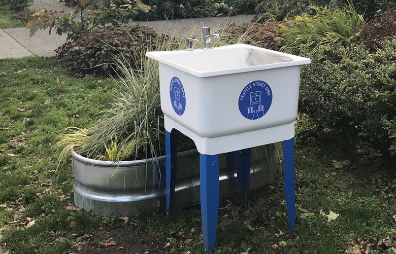 Street sinks for homeless people in front of University Heights Center on The Ave.

 A “Seattle Street Sink” has a utility sink, a soap dispenser, a planter box and a garden hose. The water drains into the planter box, which acts like a rain garden.