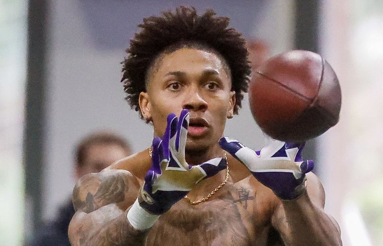 Jordan Perryman makes a reception Wednesday afternoon during Pro Day in the Dempsey Indoor Center at the University of Washington in Seattle, Washington on March 29, 2023.