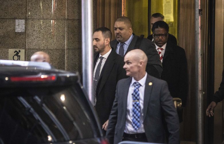 Alvin Bragg, top center, Manhattan District Attorney, leaves his office after a grand jury indicted former President Donald Trump over a $130,000 hush-money payment to porn star Stormy Daniels, March 30, 2023. A year ago, the investigation into the former president appeared to be over, but a series of crucial turning points led to this week’s indictment. (Dave Sanders/The New York Times) XNYT288 XNYT288