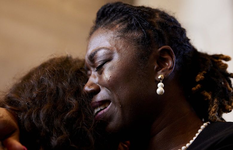 Tennessee state Sen. Charlane Oliver, a Democrat from Nashville, sheds a tear while embracing Maryam Abolfafzli at the rally against gun violence at the State Capitol Building on Thursday. MUST CREDIT: Photo for The Washington Post by Johnnie Izquierdo