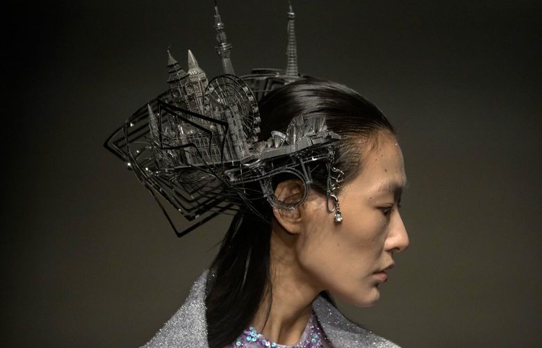 A model presents a creation from the Saint.Joy collection by Chinese designer Huizhong Bian at China Fashion Week in Beijing, Thursday, March 30, 2023. (AP Photo/Mark Schiefelbein) XMAS113 XMAS113