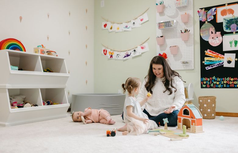 Interior designer Amanda Welch and her daughters, Lucy and Ruth Ann, enjoy spending time in this playroom together inside their Woodinville home. (Courtesy of Lauren Mitchell)
