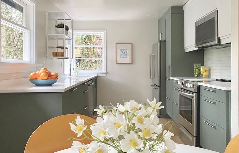 To create a lively atmosphere for spring, consider adding fresh flowers and a bright paint to your kitchen. (Courtesy of In Form Design)
