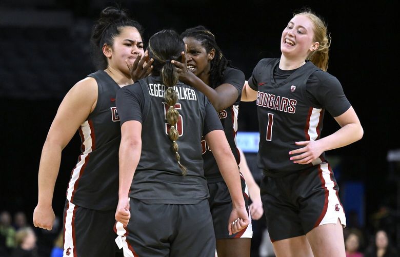 Washington State celebrates a 3-pointer by guard Charlisse Leger-Walker’s (5) against Utah during the second half of an NCAA college basketball game in the quarterfinals of the Pac-12 women’s tournament Thursday, March 2, 2023, in Las Vegas. (AP Photo/David Becker) NVDB155 NVDB155