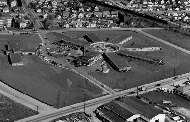 In an undated aerial, the Renton Hospital, designed by Seattle architect George W. Stoddard and opened in 1945 as a temporary post-World War II facility, was nicknamed the “wagon wheel” due to its formation. The renamed Valley General Hospital moved south and opened in 1969.