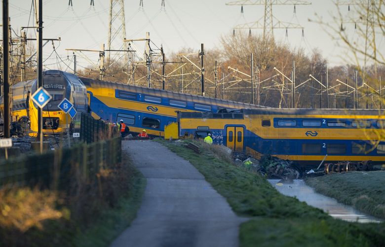 At least one person died and some 30 passengers were injured in the early hours when a train partially derailed, in Voorschoten, near The Hague, Tuesday April 4, 2023, sending at least one carriage into a field next to the tracks. (AP Photo/Peter Dejong) PDJ101 PDJ101