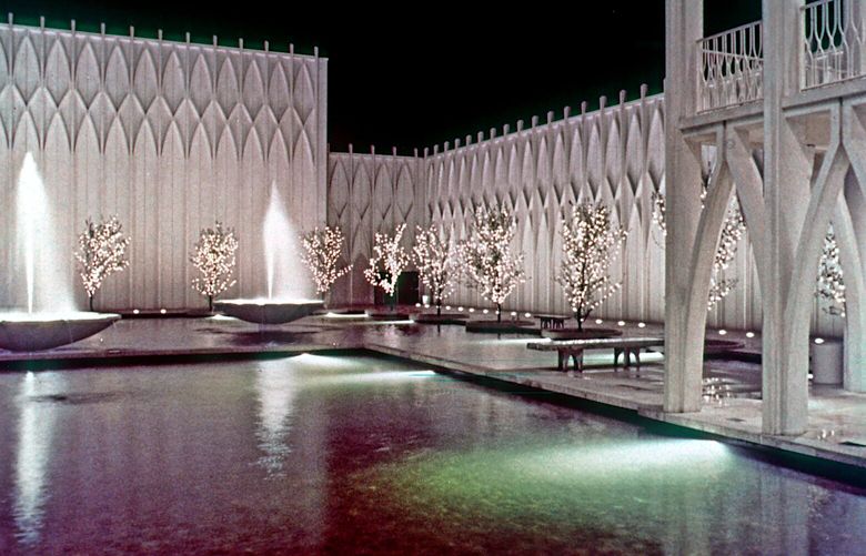 At ground level in 1962, colored lighting illuminates the rear pool.