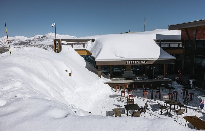 In this image provided by Mammoth Mountain, the ski resort is covered with snow in Mammoth Lakes, Calif., on March 16, 2023. The Mammoth Mountain ski resort in the Eastern Sierra said this has been its snowiest season on record, with 695 inches at the main lodge and 870 inches on the summit of the 11,053-foot peak, as of Tuesday, March 28, 2023.   (Peter Morning/Mammoth Mountain via AP) FX305 FX305