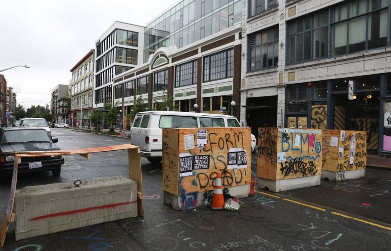 Barriers are seen looking south on 11th Ave. inside the CHOP, early Sunday morning, June, 28, 2020 in Seattle’s Capitol Hill neighborhood. 214380 214380