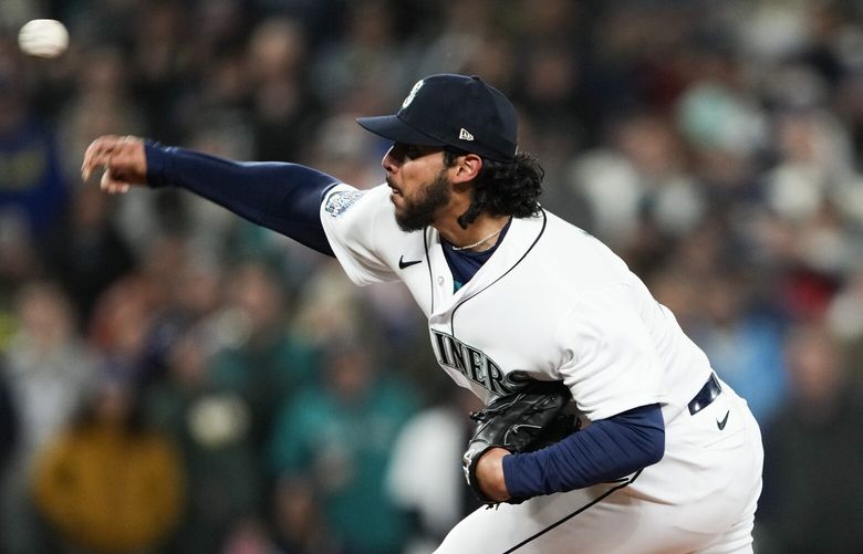 Seattle Mariners relief pitcher Andres Munoz throws to a Cleveland Guardians batter during the ninth inning of an opening day baseball game Thursday, March 30, 2023, in Seattle. The Mariners won 3-0. (AP Photo/Lindsey Wasson) WALW135 WALW135