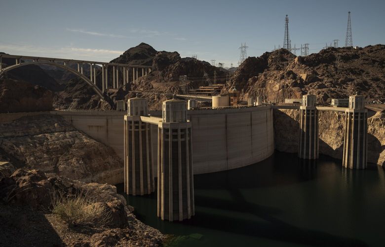 FILE — Water intake towers at the Hoover Dam, outside of Boulder City, Nev, on Feb. 2, 2023. Last summer, the water level at Lake Mead, created by the dam on the Colorado River, reached its lowest level ever. (Erin Schaff/The New York Times) XNYT131 XNYT131