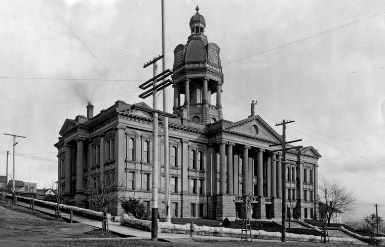 THEN: The King County Courthouse and attached jail loomed above Seattle atop First Hill for nearly 40 years. In 1916, the courthouse moved to its current digs on Third Avenue between James Street and Yesler Way, leaving behind only prisoners and jailers. (Webster & Stevens / Museum of History & Industry)