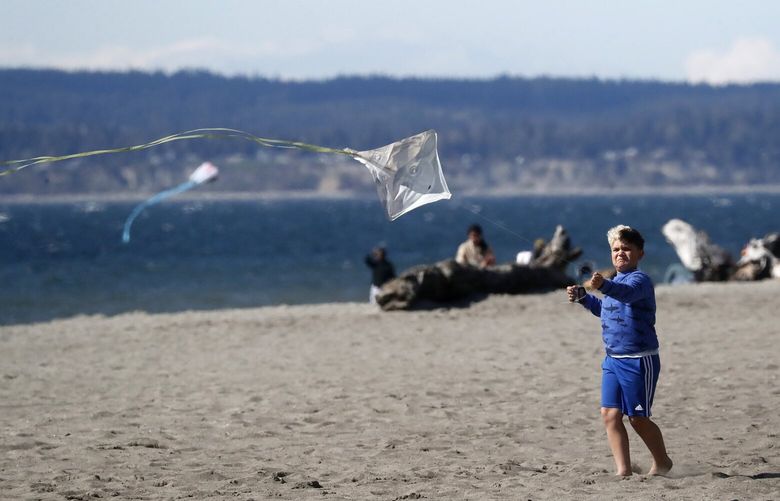 Kyan McLeod, 8, flies his kite at Golden Gardens Park in bright sun, Wednesday, April 11,  2023.

LO LO LO 223546